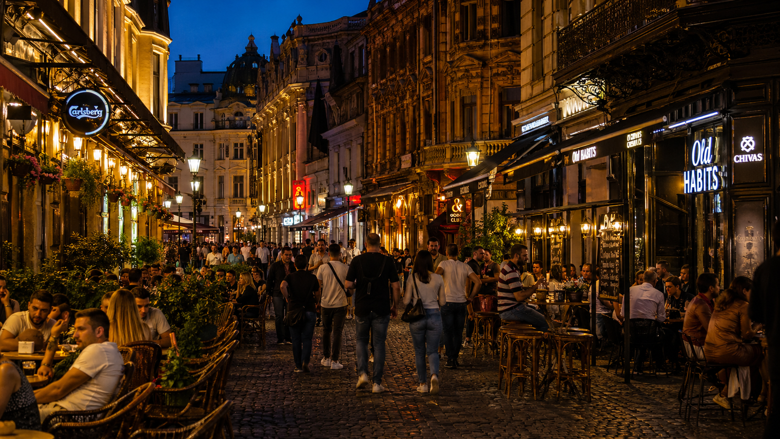 Bucharest travel guide: Evening nightlife in Bucharest Old Town with warm lights and lively historic streets.