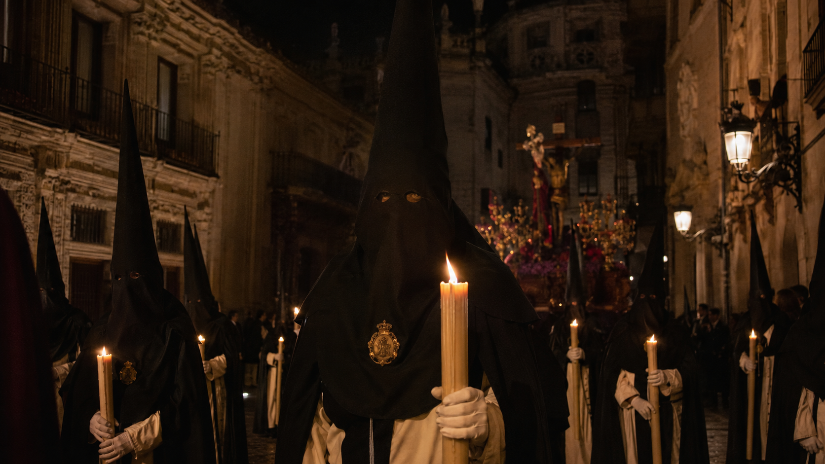 Candlelit Semana Santa procession moving through a Spanish old town at night.