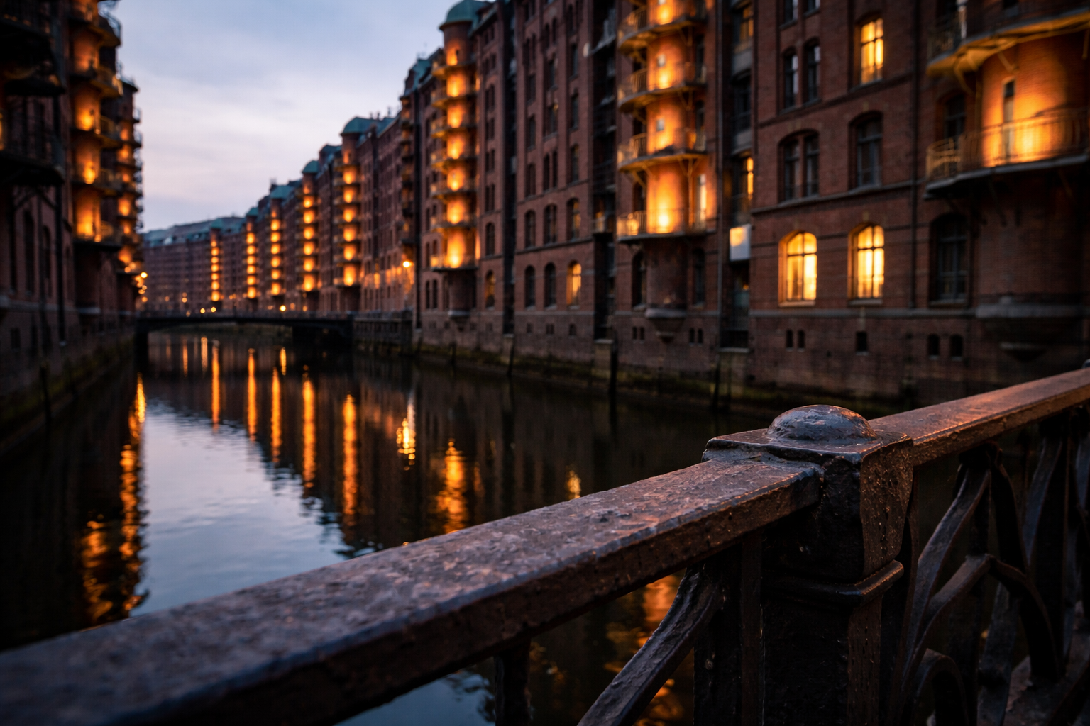 Red-brick warehouses and canal reflections in twilight at Speicherstadt.