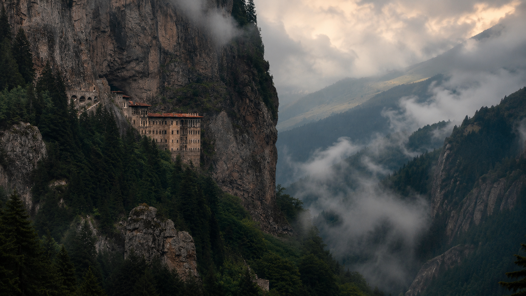 Sumela Monastery built into a steep forested mountain cliff in Turkey