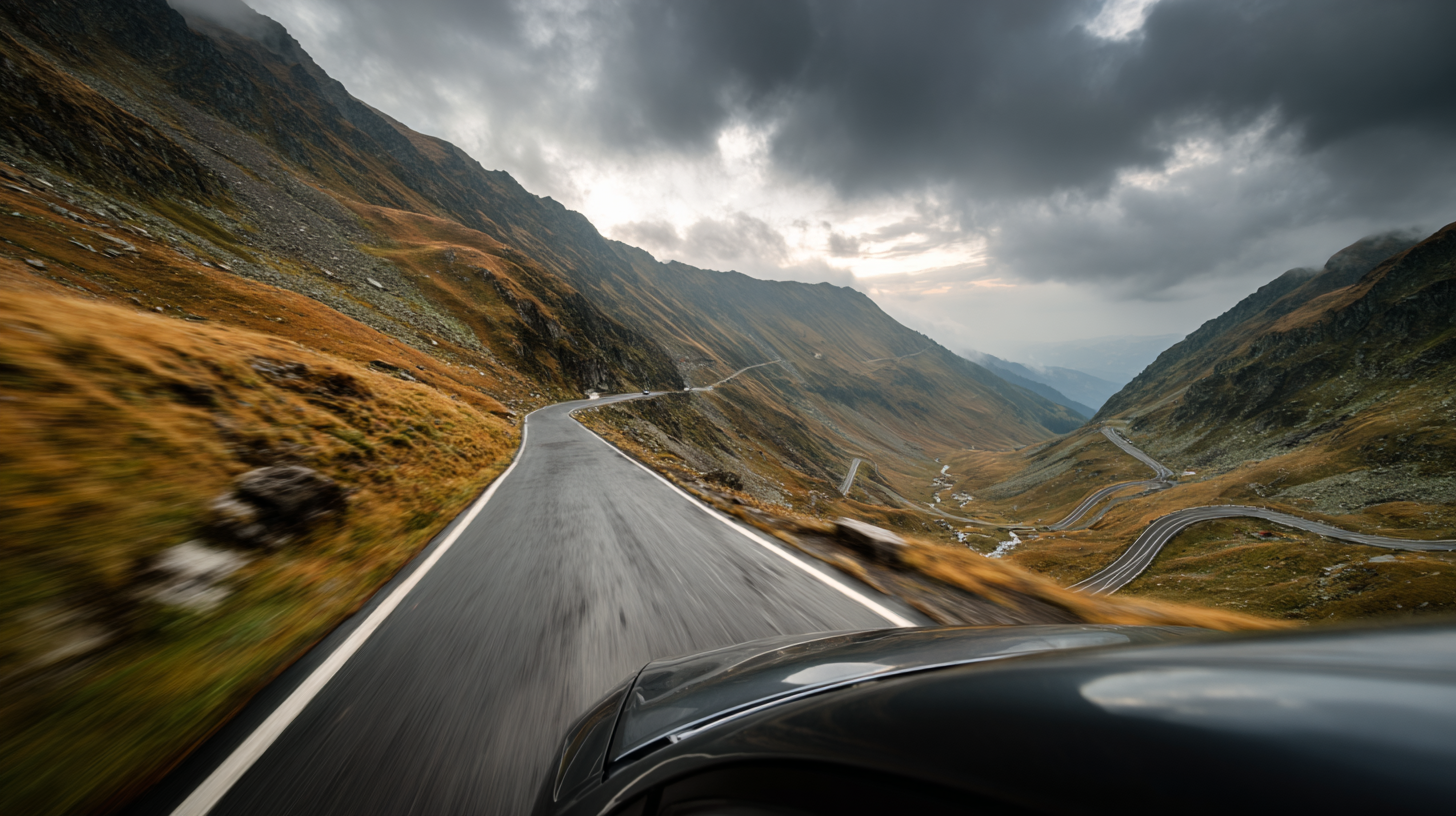 Car moving through dramatic curves on the Transfagarasan road.