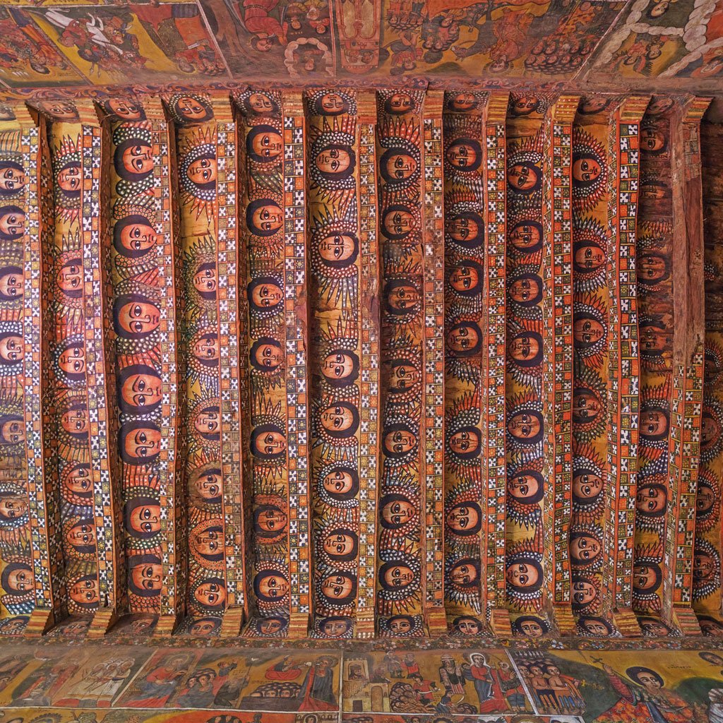 Images of the Debre Berhan Selassie Church in Gondar, especially the ceiling adorned with angel faces.