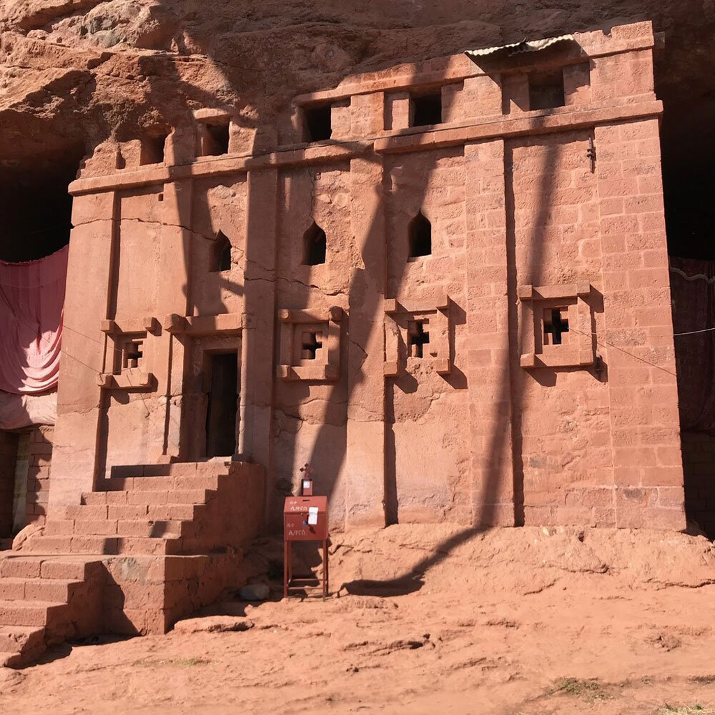 Photos of the rock-hewn churches of Lalibela, focusing on ancient religious paintings.