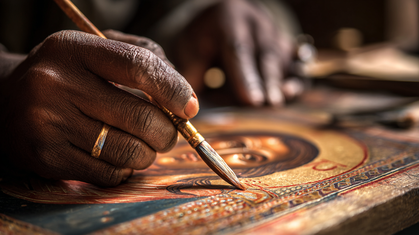 Close-up of an Ethiopian icon painter working on a traditional religious image.