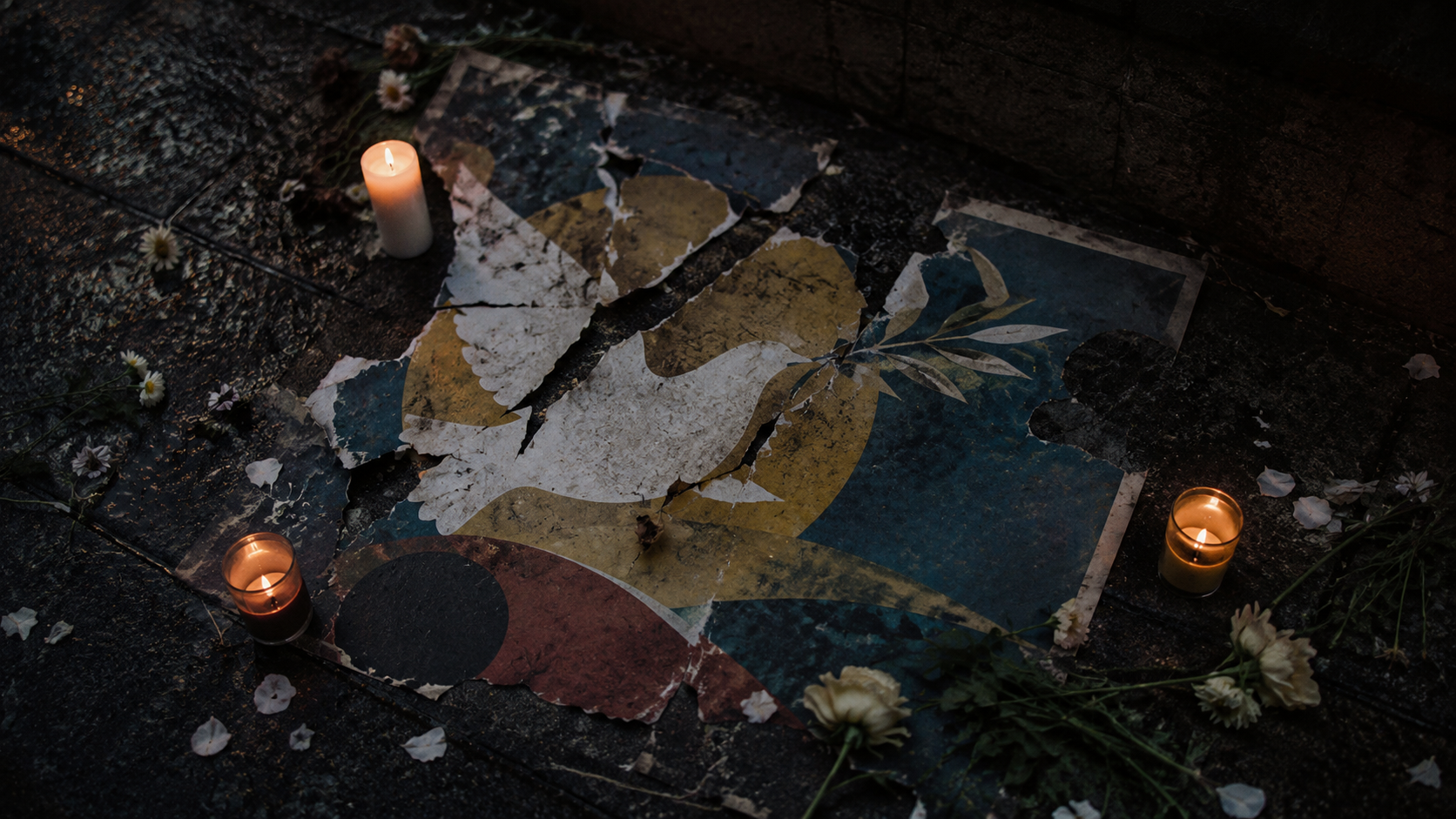 Candles and torn paper symbolizing the collapse of trust in the peace process